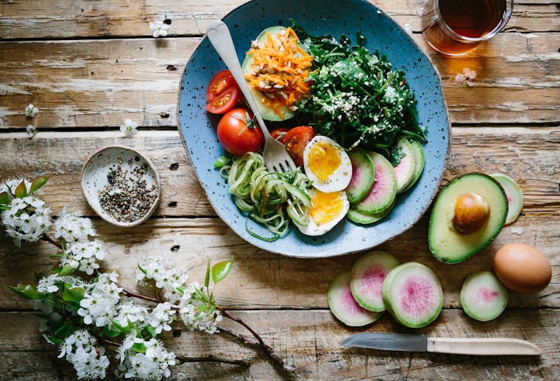 Beautiful paleo food spread with meats, vegetables, and nuts